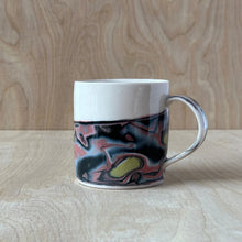 Load image into Gallery viewer, Porcelain mug with marbled design on a wooden surface