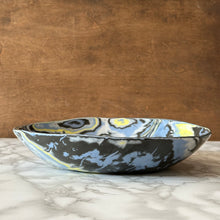 Load image into Gallery viewer, Ceramic bowl with abstract design on a marble surface and wooden background
