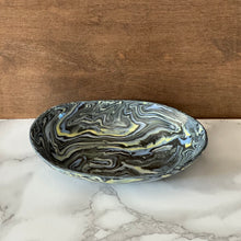 Load image into Gallery viewer, Decorative ceramic bowl with marbled pattern on a marble surface with wooden background
