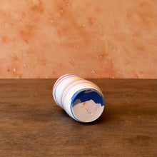 Load image into Gallery viewer, Colored porcelain vase lying on its side revealing the colors on the bottom.
