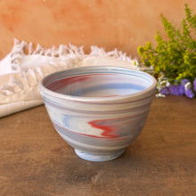 Load image into Gallery viewer, Ceramic colored porcelain bowl with striped pattern on a wooden surface with a soft background
