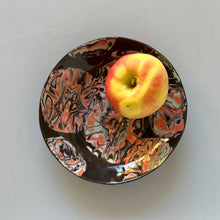 Load image into Gallery viewer, Decorative plate with a colorful abstract design holding an apple on a light gray background
