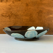 Load image into Gallery viewer, Ceramic bowl with blue floral patterns on a wooden background

