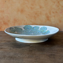 Load image into Gallery viewer, Ceramic bowl with floral design on a wooden surface

