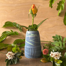 Load image into Gallery viewer, Floral arrangement with a blue vase on a wooden surface
