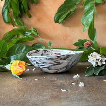 Load image into Gallery viewer, Marble-patterned ceramic bowl on a wooden surface with greenery and flowers.
