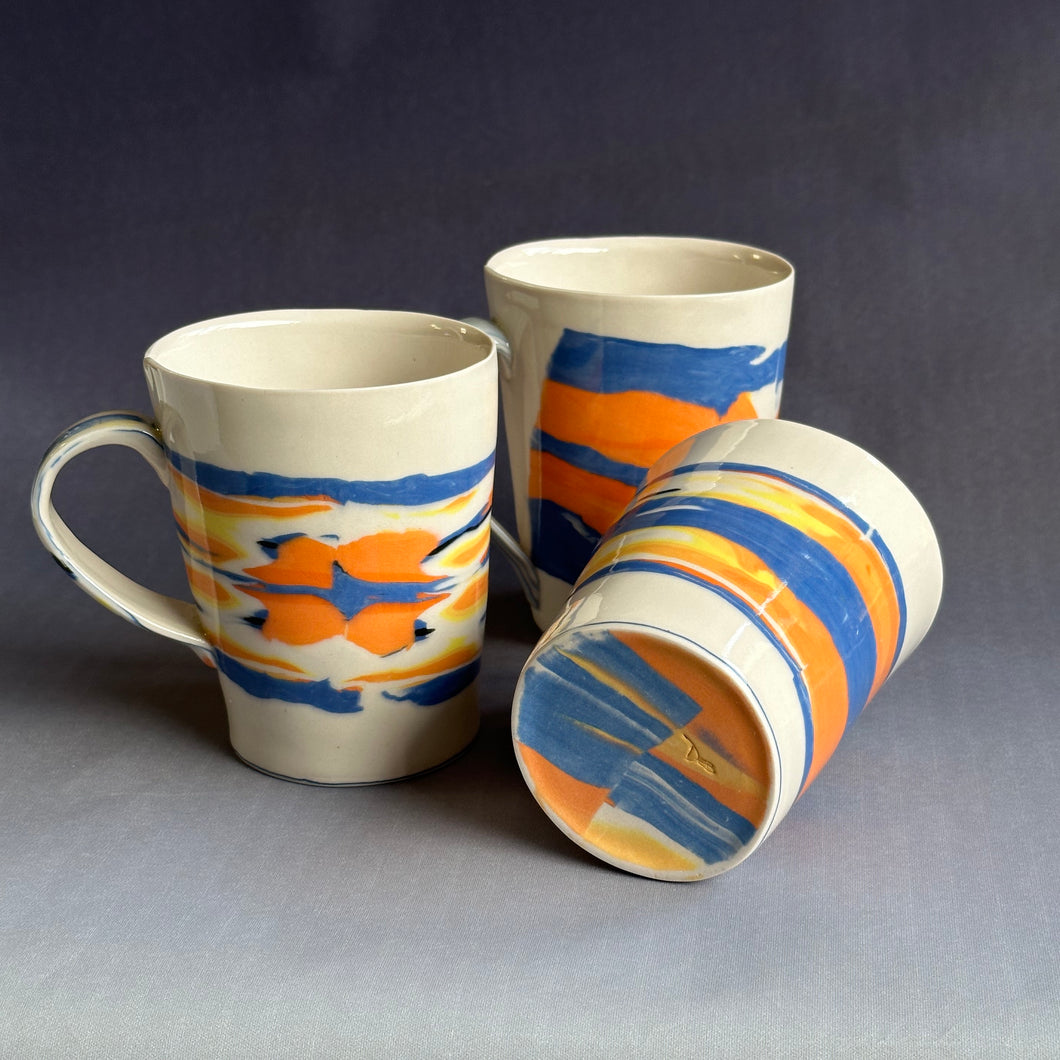 Orange, blue and yellow mug set